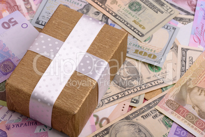 american money and golden gift box, european money