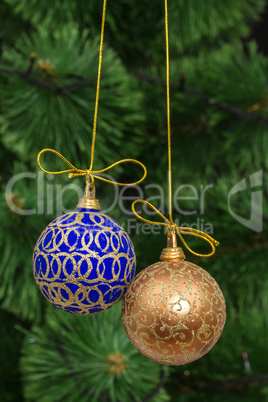 Beautiful Christmas balls on  background of green fir-tree