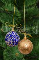 Beautiful Christmas balls on  background of green fir-tree