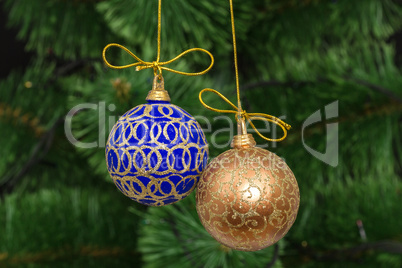 Beautiful Christmas balls on  background of green fir-tree