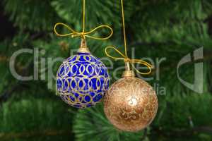 Beautiful Christmas balls on  background of green fir-tree
