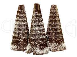 Three chocolate cone in the form a snowy trees