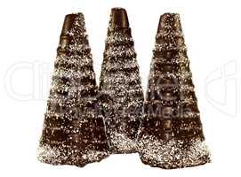 Three chocolate cone in the form a snowy trees