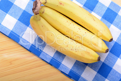 Bunch of bananas on white bowl, health food concept