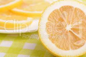 Background of yellow ripe lemons. A slice of lemon.