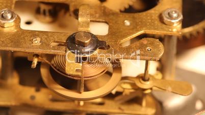 revolve wheels and gears inside the old clock