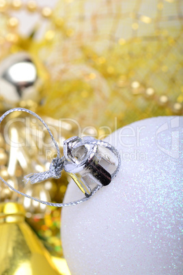 festive golden christmas decoration, candles, white balls, green fir tree branch, close up