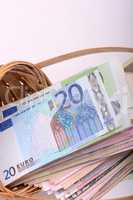 european money on wooden basket