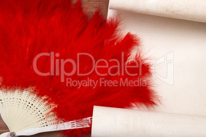 Decorative female fan of red feathers