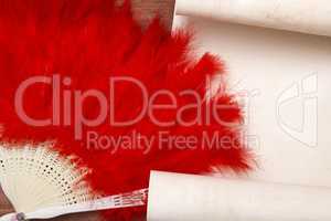 Decorative female fan of red feathers