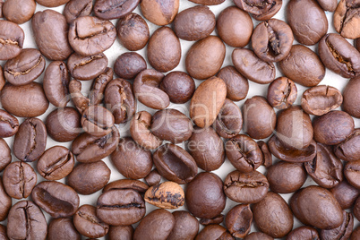 Brown coffee beans,  close-up of coffee beans for background and texture