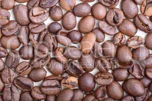 Brown coffee beans,  close-up of coffee beans for background and texture