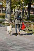 Girl and dog walking