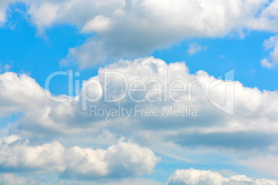 white fluffy clouds in the blue sky