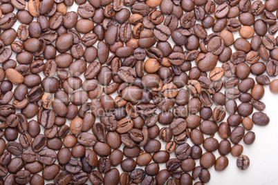 Brown coffee beans,  close-up of coffee beans for background and texture