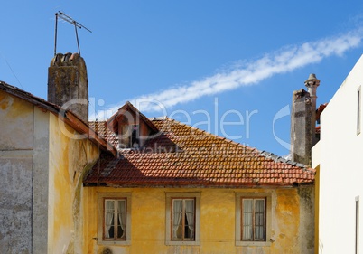 An old house in Sintra, Portugal, with tile roof and garret