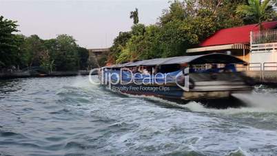 Waterway and fast speed riverboat ride in Bangkok, Thailand
