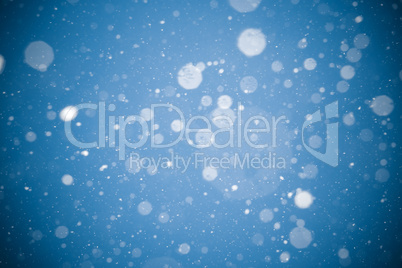 Winter background. falling snow on blue background