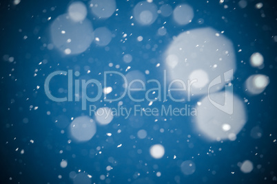 Winter background. falling snow on blue background