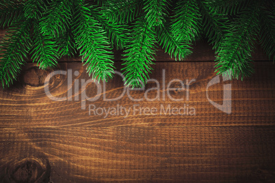 Christmas wooden background with fir tree