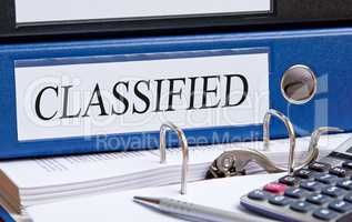 Classified - blue binder in the office