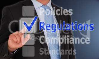 Regulations - Businessman with checkbox
