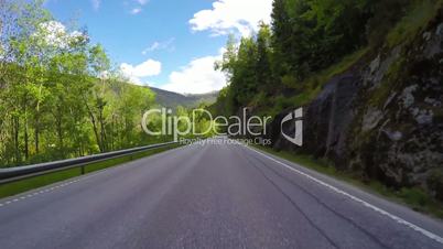 Driving a Car on a Road in Norway