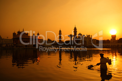 Cleaning the pool of the Golden Temple, India