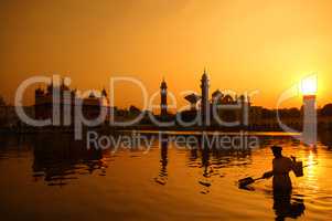 Cleaning the pool of the Golden Temple, India