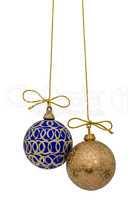 Beautiful Christmas balls are suspended on a gold thread, isolat