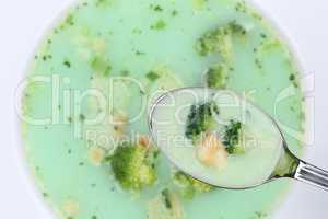 Brokkolisuppe essen mit Löffel Brokkoli Suppe in Suppentasse vo