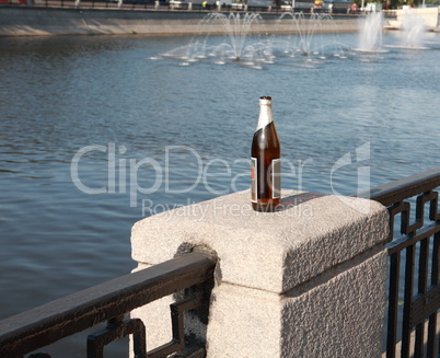 bottle on fence