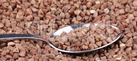 buckwheat background and teaspoon