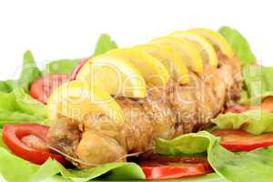 rolled chicken meat with lemon and salad