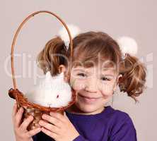 happy little girl with dwarf bunny pet