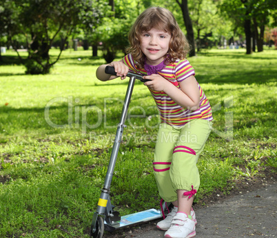 little girl with scooter