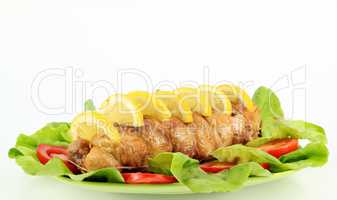 chicken meat with lemon and salad