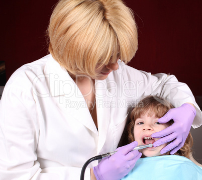 dentist perform a dental exam