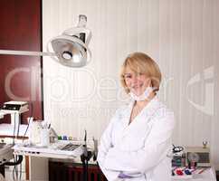 female dentist posing in ordination office