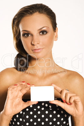 Beautiful smiling woman holding a membership card