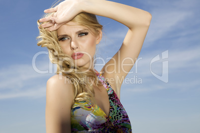 beautiful girl on background blue sky