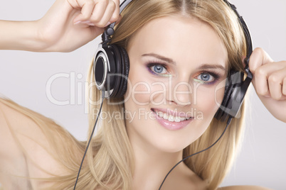 Beautiful girl is listen to the music