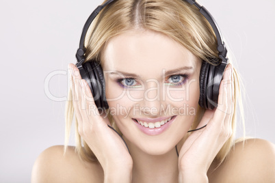 Beautiful girl is listen to the music