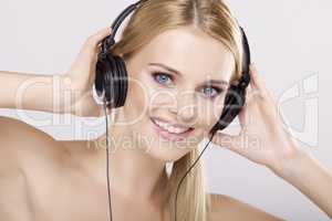 Beautiful girl is listen to the music