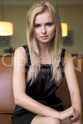 blond woman in black dress