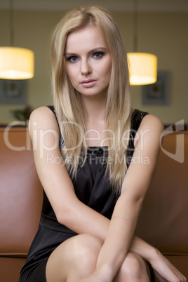 blond woman in black dress