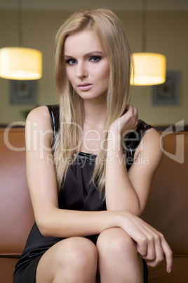 blond woman in black dress