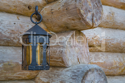 Old street light closeup on wooden wall