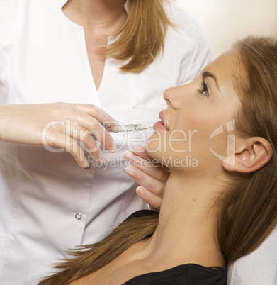 young beautiful woman having an injection