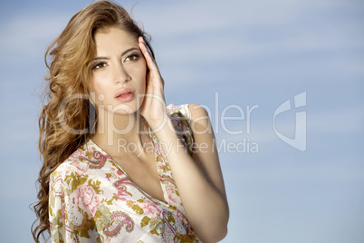 beautiful girl on background blue sky